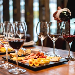 Close-up on a sommelier serving glasses of winetasting event